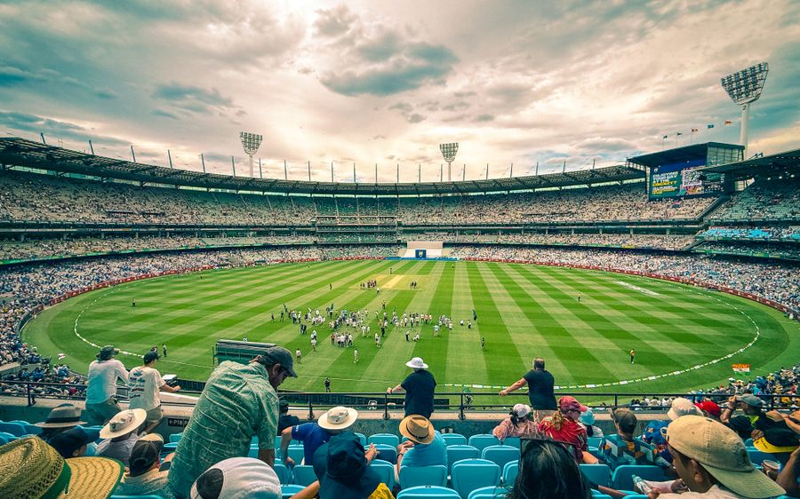 Cricket match at a packed stadium